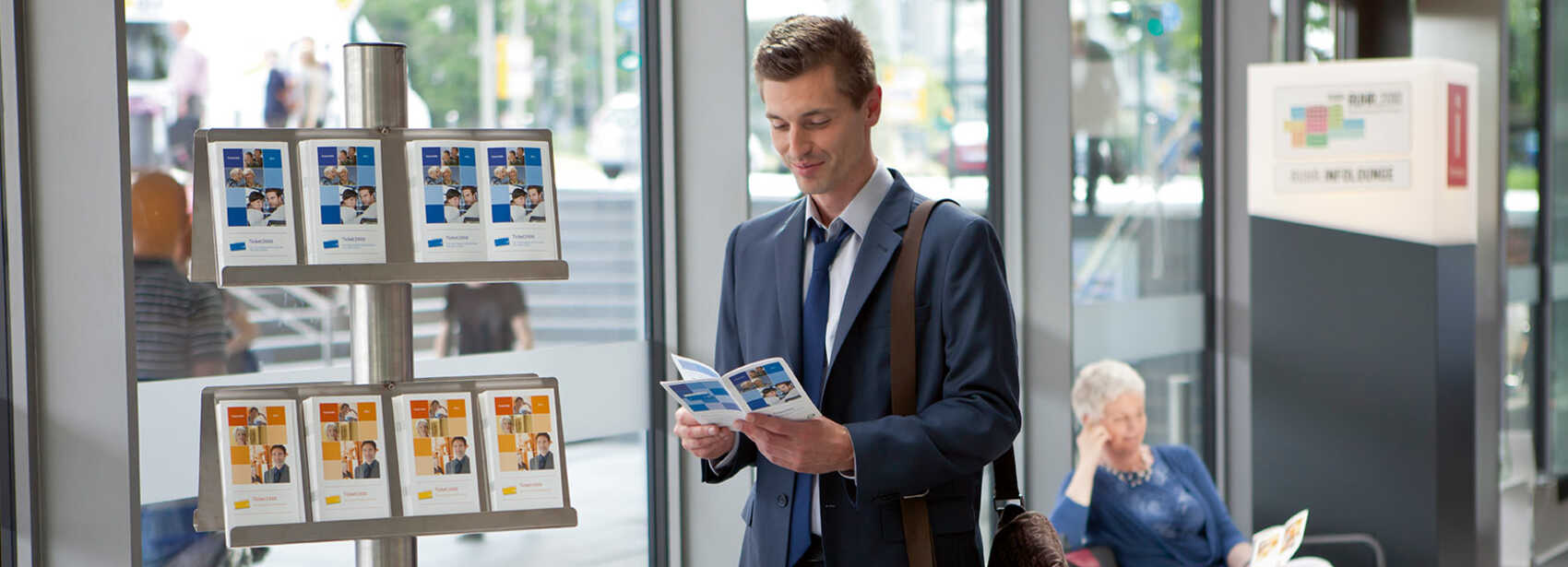 Person looks at STOAG brochures